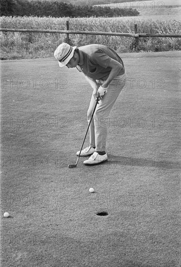Golfer putting, Sweden, 1969. Artist: Unknown