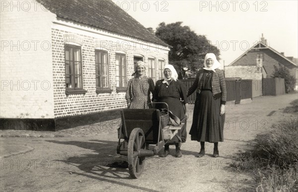 Three women on their way to town to sell fish their husbands have caught, Landskrona, Sweden. Artist: Unknown