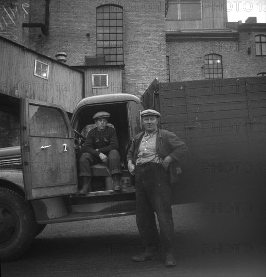 Lorry drivers at the sugar mill in Arlöv, Scania, Sweden, c1940s(?). Artist: Otto Ohm