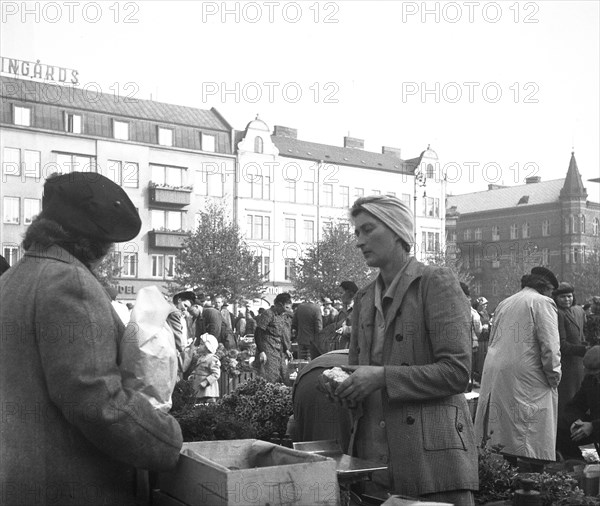 Scene in the market, Malmö, Sweden, 1947. Artist: Otto Ohm