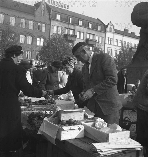 Fruit and vegetable stall in the market, Malmö, Sweden, 1947. Artist: Otto Ohm