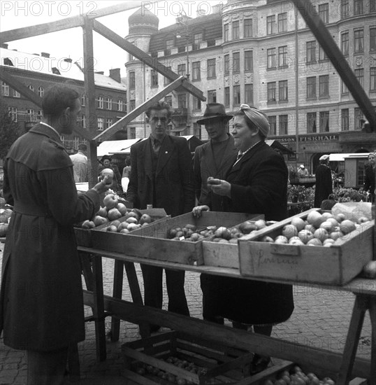 Fruit and vegetable stall in the market, Malmö, Sweden, 1947. Artist: Otto Ohm