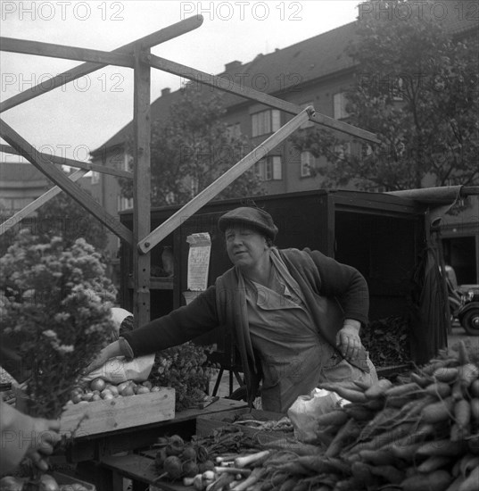 Fruit and vegetable stall in the market, Malmö, Sweden, 1947. Artist: Otto Ohm