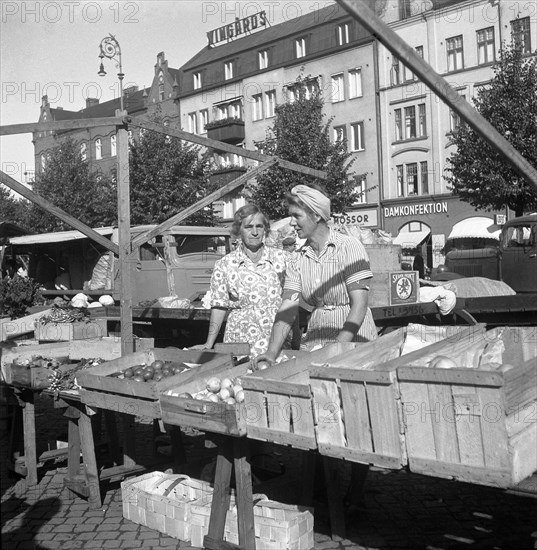 Fruit and vegetable stall in the market, Malmö, Sweden, 1947. Artist: Otto Ohm