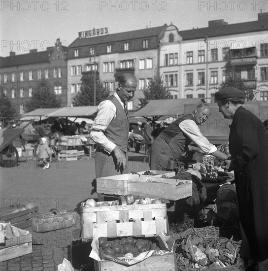 Fruit and vegetable stall in the market, Malmö, Sweden, 1947. Artist: Otto Ohm