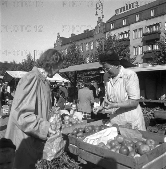 Fruit and vegetable stall in the market, Malmö, Sweden, 1947. Artist: Otto Ohm