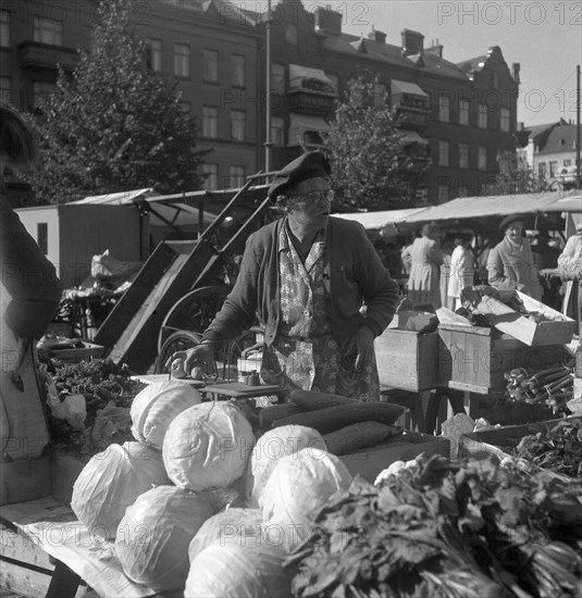 Fruit and vegetable stall in the market, Malmö, Sweden, 1947. Artist: Otto Ohm