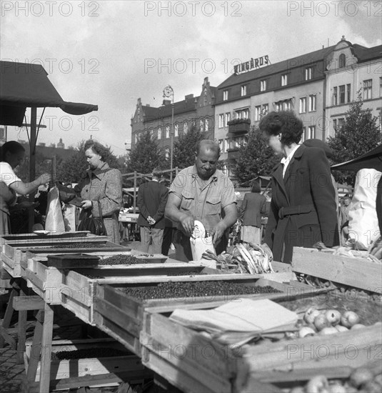 Fruit and vegetable stall in the market, Malmö, Sweden, 1947. Artist: Otto Ohm