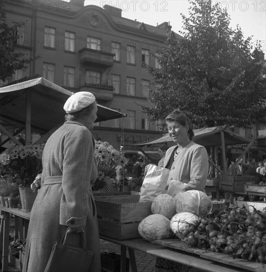 Fruit and vegetable stall in the market, Malmö, Sweden, 1947. Artist: Otto Ohm