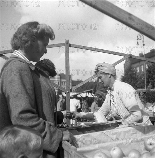 Fruit and vegetable stall in the market, Malmö, Sweden, 1947. Artist: Otto Ohm