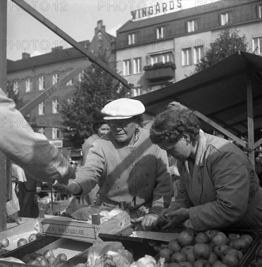 Fruit and vegetable stall in the market, Malmö, Sweden, 1947. Artist: Otto Ohm