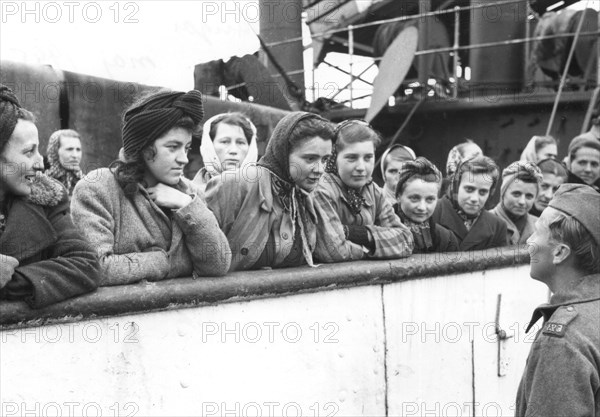 Women talking to a soldier, Trelleborg harbour, Sweden, May 1945. Artist: Unknown