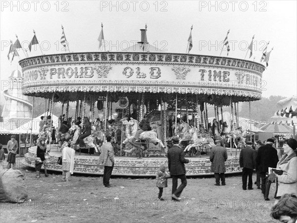 James Noyce's 'Galloping Horses' carousel ride, Goose Fair, Nottingham, Nottinghamshire, 1973. Artist: WE Middleton & Son