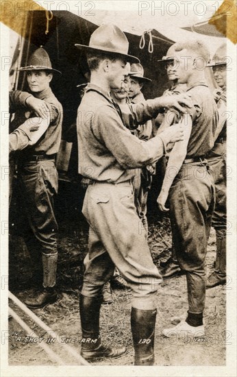 A young man getting a shot in the arm, Fort Sheridan, Illinois, USA, 1920. Artist: Unknown