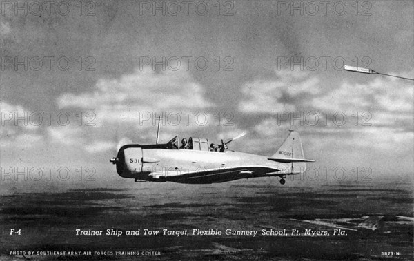 Rear gunner shooting at a tow target, Flexible Gunnery School, Fort Myers, Florida, USA, 1943. Artist: Southeast Army Air Forces Training Center