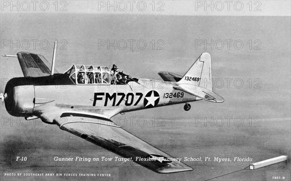 Gunner firing on a tow target, Flexible Gunnery School, Fort Myers, Florida, USA, 1943. Artist: Southeast Army Air Forces Training Center