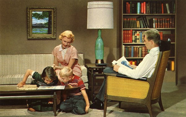 Family sitting in their living room, USA, 1962. Artist: Unknown