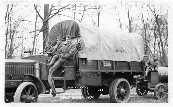 Photo of three soldiers sitting on a truck, Fort Sheridan, Illinois, USA, 1933. Artist: Unknown