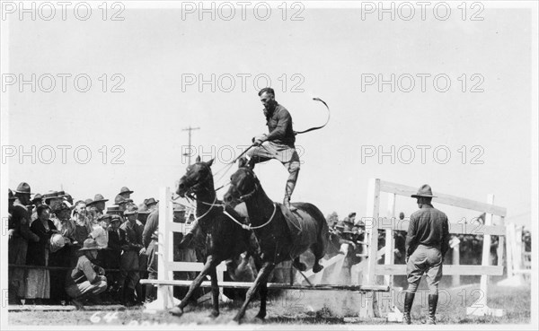 Soldier performing equestrian acrobatics, Fort Sheridan, Illinois, USA, 1940. Artist: Unknown