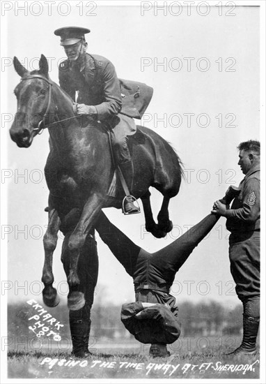 Soldiers performing equestrian stunts, Fort Sheridan, Illinois, USA, 1920. Artist: Unknown