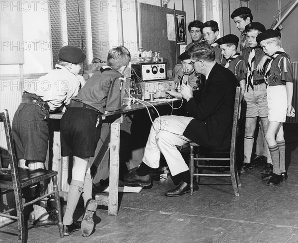 Boy scouts learning radio transmitting, 1960s.