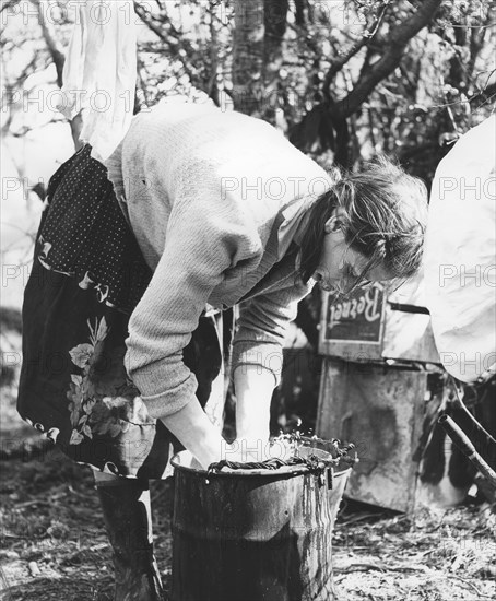 Gypsy woman washing clothes, 1960s.