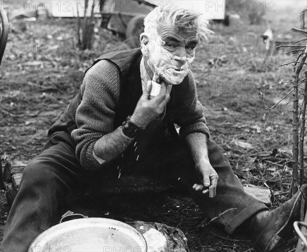 Gypsy man shaving, 1960s.