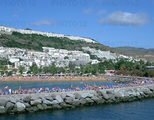 Beach and breakwater, Puerto Rico, Gran Canaria, Canary Islands.