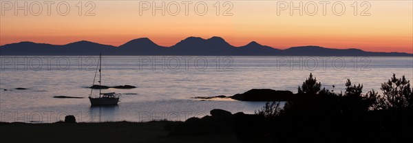 Sunset over Jura seen from Kintyre, Argyll and Bute, Scotland.