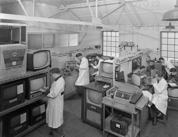 Technicians at work in Clays TV repair in shop, Mexborough, South Yorkshire, February 1959. Artist: Michael Walters