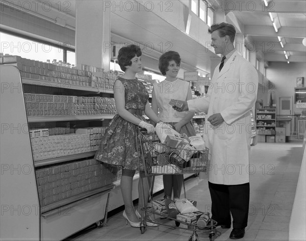 Supermarket shoppers and salesman, Co-op, Barnsley, South Yorkshire, 1961. Artist: Michael Walters