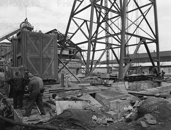 Installing a cage at Hickleton Main pit, Thurnscoe, South Yorkshire, 1961. Artist: Michael Walters