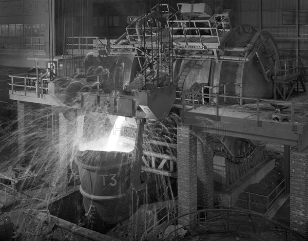 Pouring molten iron, Park Gate steelworks, Rotherham, South Yorkshire, 1964. Artist: Michael Walters