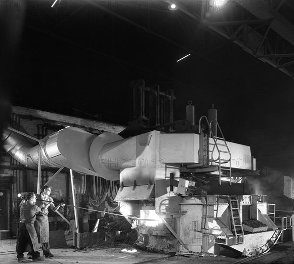 Checking the temperature of molten steel, Sheffield, South Yorkshire, 1964. Artist: Michael Walters