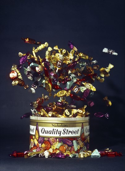 Mackintosh's Quality Street, exploding tin advertisment shot, 1972. Artist: Michael Walters