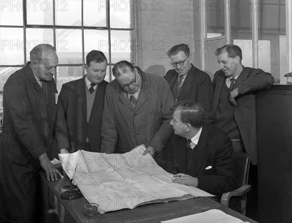 A group of foundry staff with technical drawings, Sheffield, South Yorkshire, 1963. Artist: Michael Walters