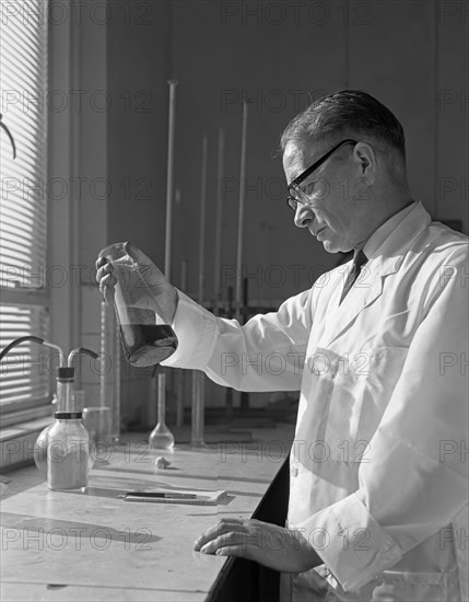 Lab technician at a steelworks in Sheffield, South Yorkshire, 1963. Artist: Michael Walters