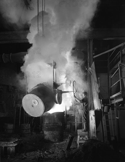 Teeming (pouring) molten iron at Edgar Allen's steel foundry, Sheffield, South Yorkshire, 1964. Artist: Michael Walters