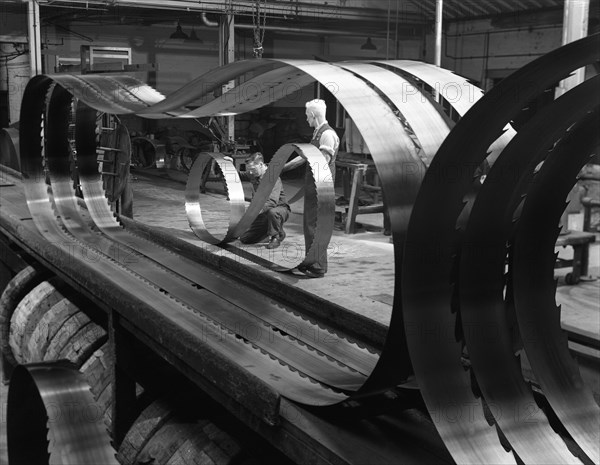 Giant bandsaw blades, Slack Sellers & Co, Sheffield, South Yorkshire, 1963.  Artist: Michael Walters