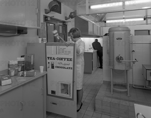 Loading a drinks vending machine at an experimental kitchen in Sheffield, South Yorkshire, 1966. Artist: Michael Walters
