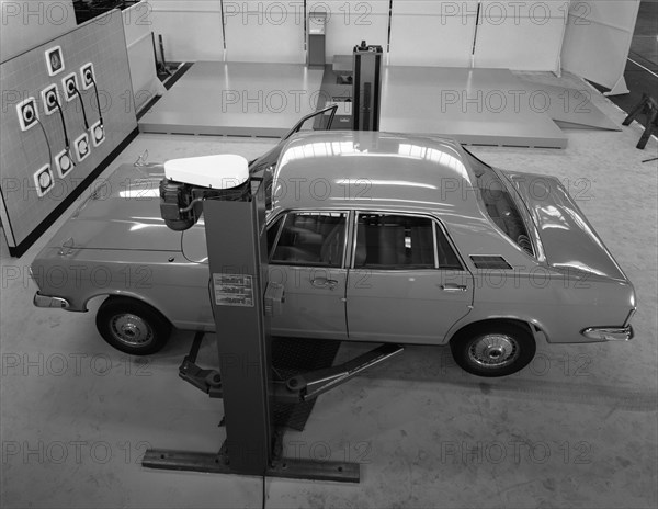 Ford Zodiac on an asymmetric lift, Sheffield, South Yorkshire, 1972.  Artist: Michael Walters