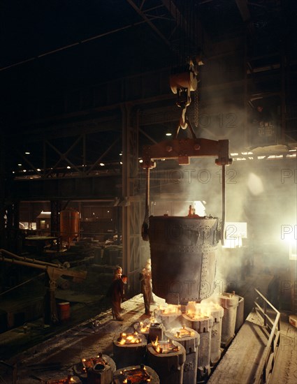 Teeming (pouring) molten iron, Brown Bayley Steels, Sheffield, South Yorkshire, 1968.  Artist: Michael Walters