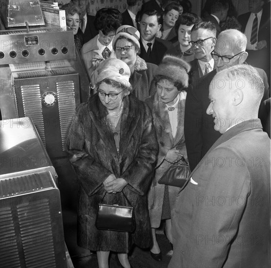 Women in fur coats at a food exhibition, Wilsic, near Doncaster, South Yorkshire, 1961.  Artist: Michael Walters