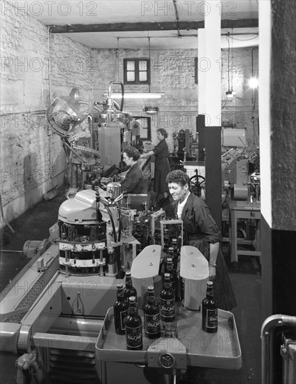 The final stages of bottling whisky at Wiley & Co, Sheffield, South Yorkshire, 1960.  Artist: Michael Walters