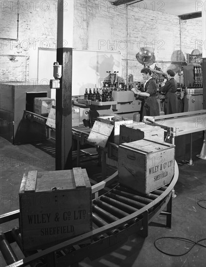 The final stages of bottling whisky at Wiley & Co, Sheffield, South Yorkshire, 1960.  Artist: Michael Walters