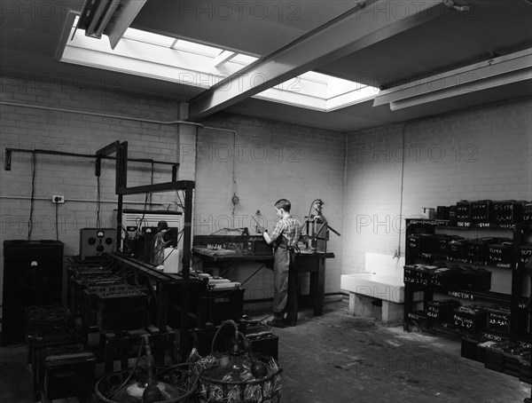 Scene in the workshops of Globe & Simpson auto electricians, Lincoln, Lincolnshire, 1961. Artist: Michael Walters