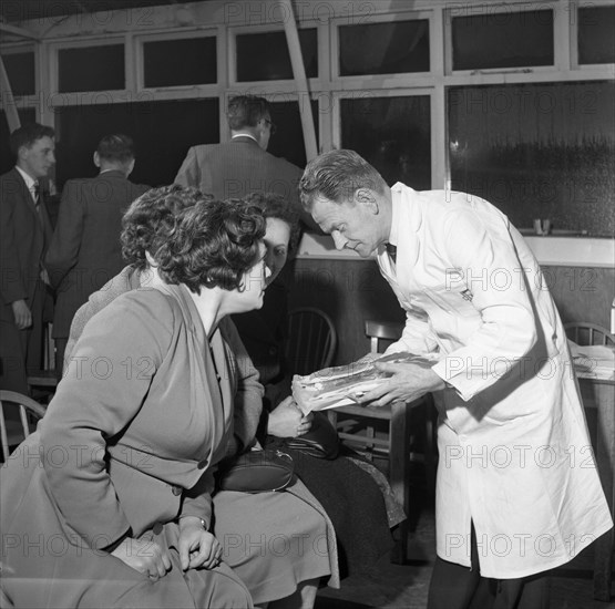 Butcher from Danish Bacon giving a demonstration, Kilnhurst, South Yorkshire, 1961.  Artist: Michael Walters