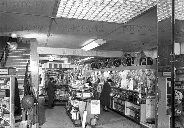 Customers in the Barnsley Co-op's sports department, South Yorkshire, 1957. Artist: Michael Walters
