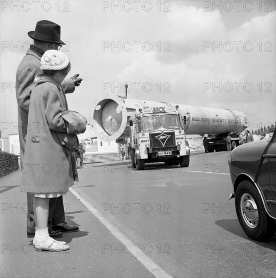 An absorption tower being transported by road, Dukenfield, Manchester, 1962. Artist: Michael Walters