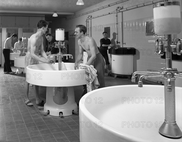 Workers in the washroom facility at a steelworks, Rotherham, South Yorkshire, 1964. Artist: Michael Walters